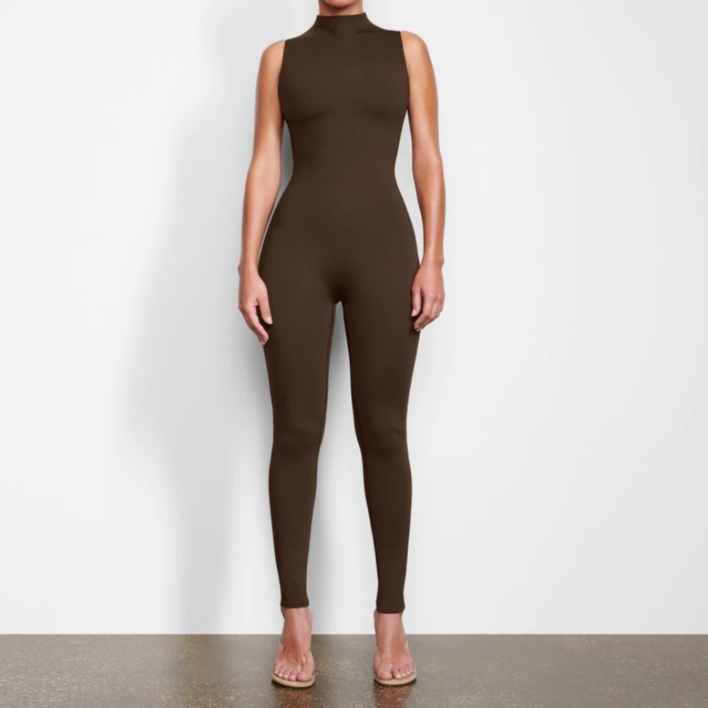 SKIMS ALL-IN-ONE MOCK NECK SLEEVELESS ONESIE.